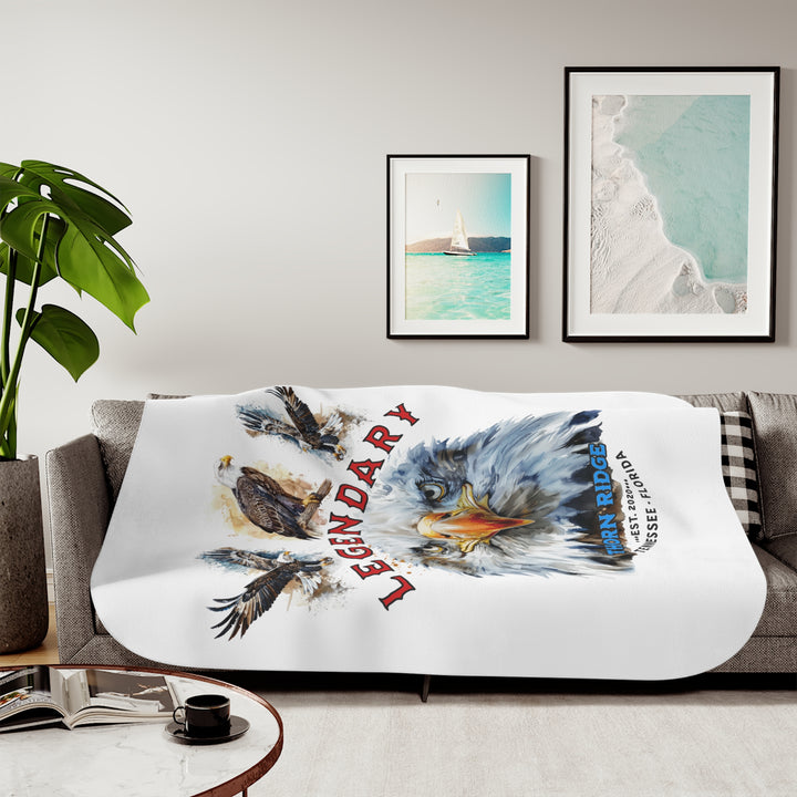 white sherpa blanket with the text Legendary and three bald eagles above the text and a close up of a bald eagle's face below the text. Branded as Thorn Ridge® EST 2020 Tennessee - Florida