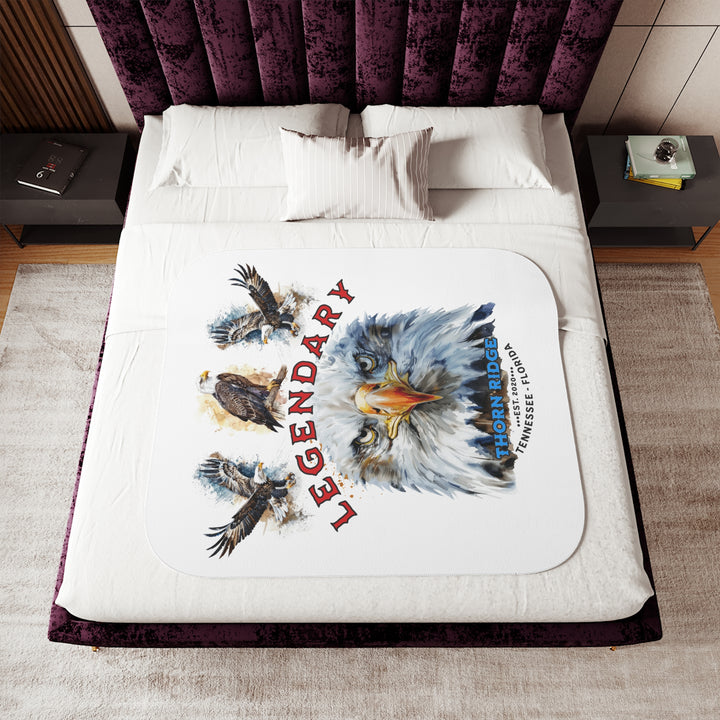 white sherpa blanket with the text Legendary and three bald eagles above the text and a close up of a bald eagle's face below the text. Branded as Thorn Ridge® EST 2020 Tennessee - Florida