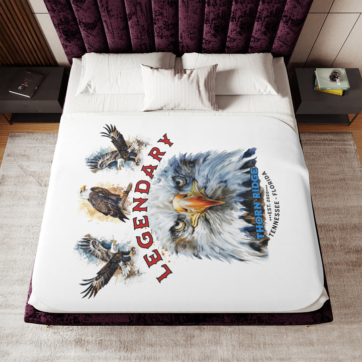 white sherpa blanket with the text Legendary and three bald eagles above the text and a close up of a bald eagle's face below the text. Branded as Thorn Ridge® EST 2020 Tennessee - Florida