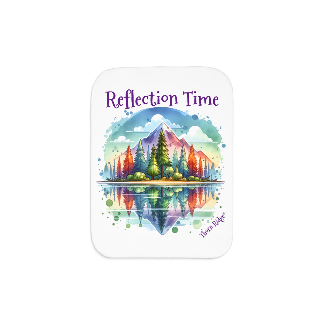 Colorful mountain design with 'Reflection Time' text on a white sherpa blanket with the branding Thorn Ridge®