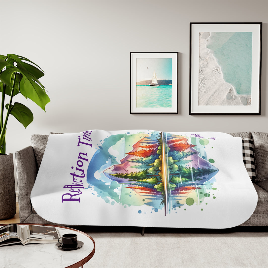 Colorful mountain design with 'Reflection Time' text on a white sherpa blanket with the branding Thorn Ridge®