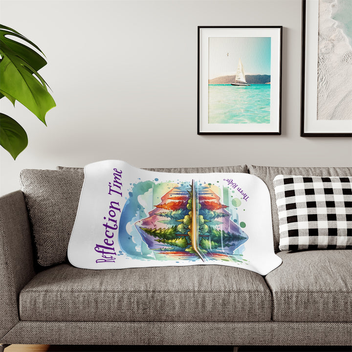 Colorful mountain design with 'Reflection Time' text on a white sherpa blanket with the branding Thorn Ridge®