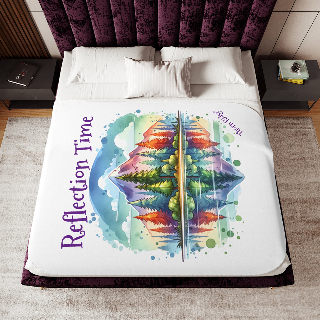 Colorful mountain design with 'Reflection Time' text on a white sherpa blanket with the branding Thorn Ridge®