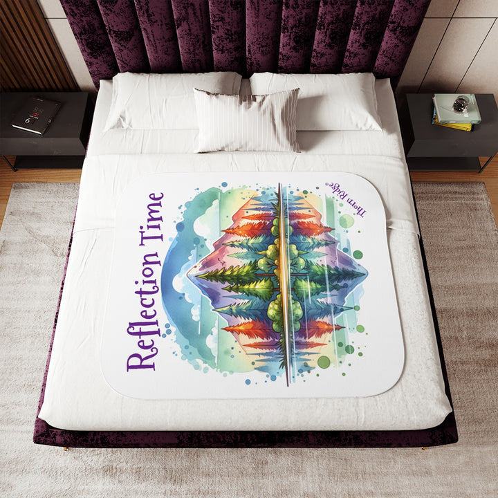 Colorful mountain design with 'Reflection Time' text on a white sherpa blanket with the branding Thorn Ridge®