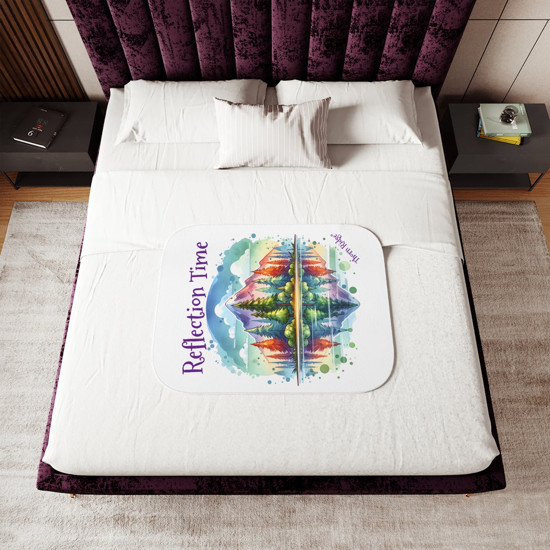 Colorful mountain design with 'Reflection Time' text on a white sherpa blanket with the branding Thorn Ridge®