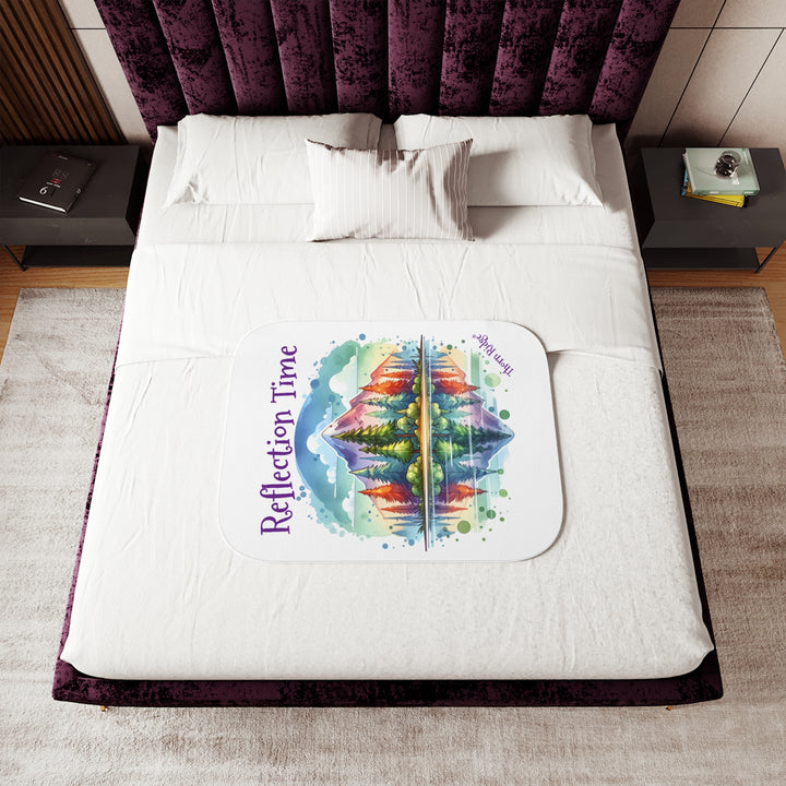 Colorful mountain design with 'Reflection Time' text on a white sherpa blanket with the branding Thorn Ridge®