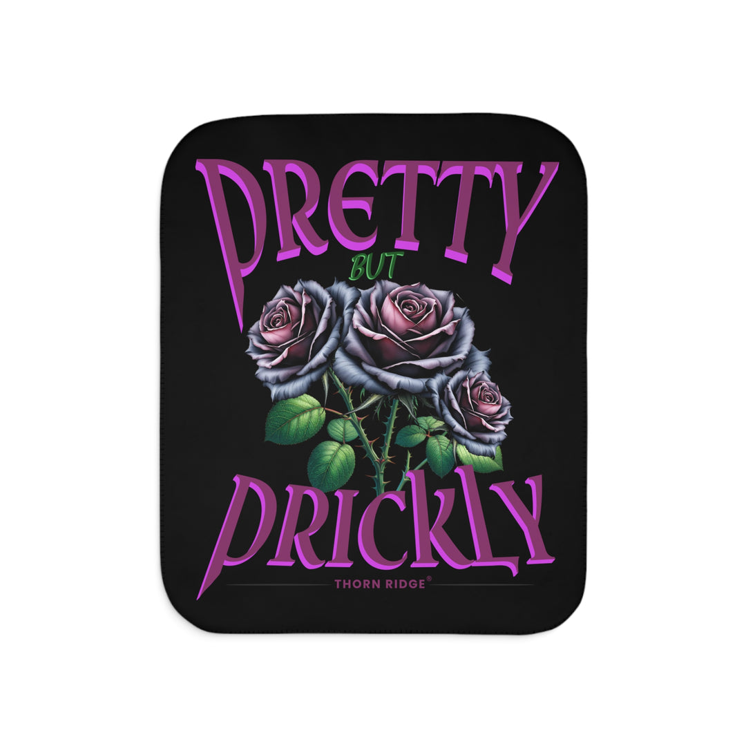 Pretty but Prickly Thorn Ridge® Roses - black and dark purple roses on a black sherpa blanket.