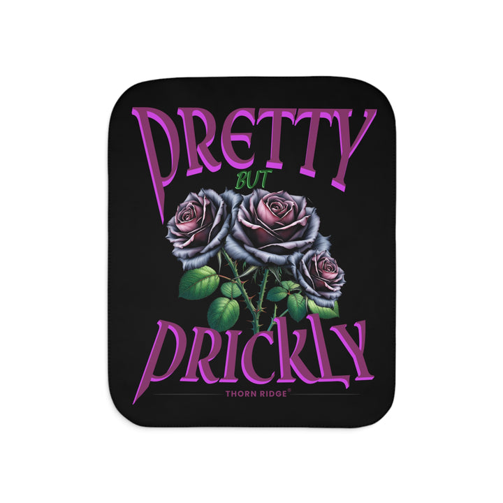 Pretty but Prickly Thorn Ridge® Roses - black and dark purple roses on a black sherpa blanket.