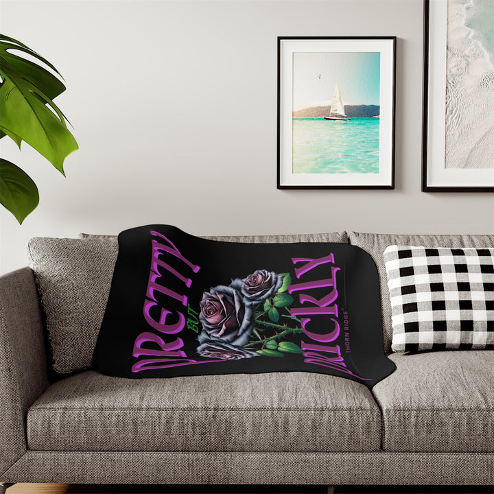 Pretty but Prickly Thorn Ridge® Roses - black and dark purple roses on a black sherpa blanket.