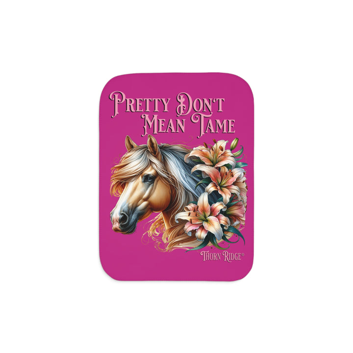 Pretty Don't Mean Tame hot pink sherpa blanket with an illustration of a palomino horse and flowers by Thorn Ridge®