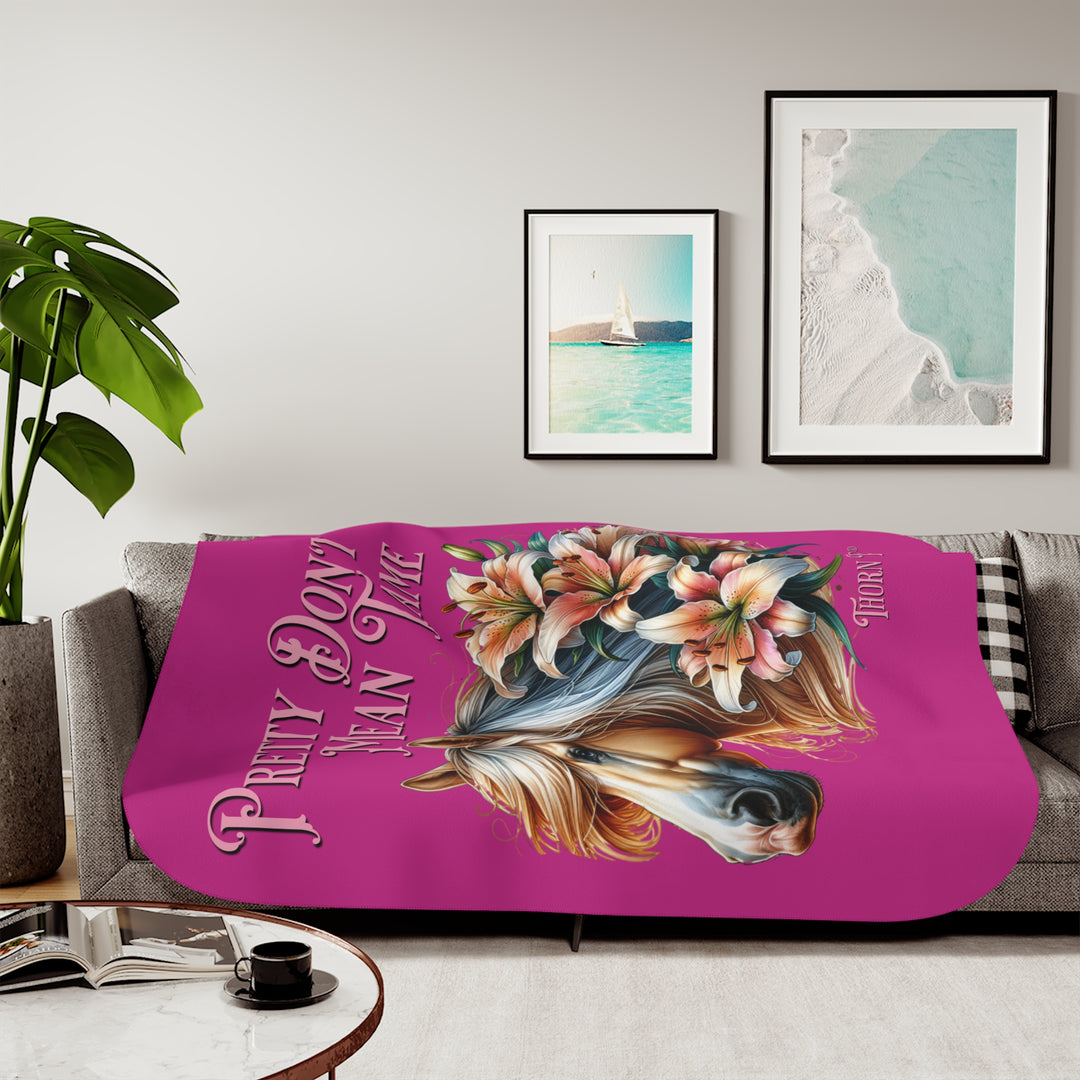 Pretty Don't Mean Tame hot pink sherpa blanket with an illustration of a palomino horse and flowers by Thorn Ridge®