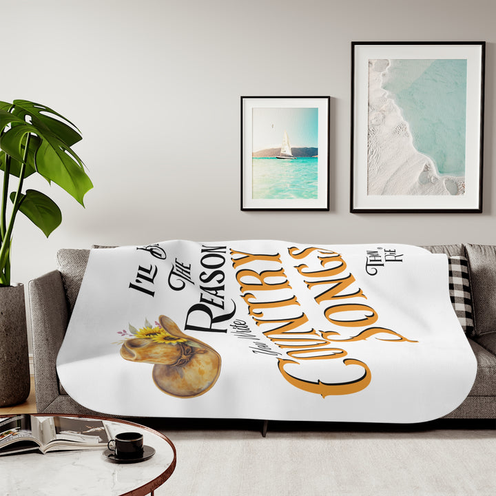 Decorative white sherpa blanket with a yellow sunflower cowgirl hat, sunflower, and text 'I'll be the reason you write country songs' by Thorn Ridge®