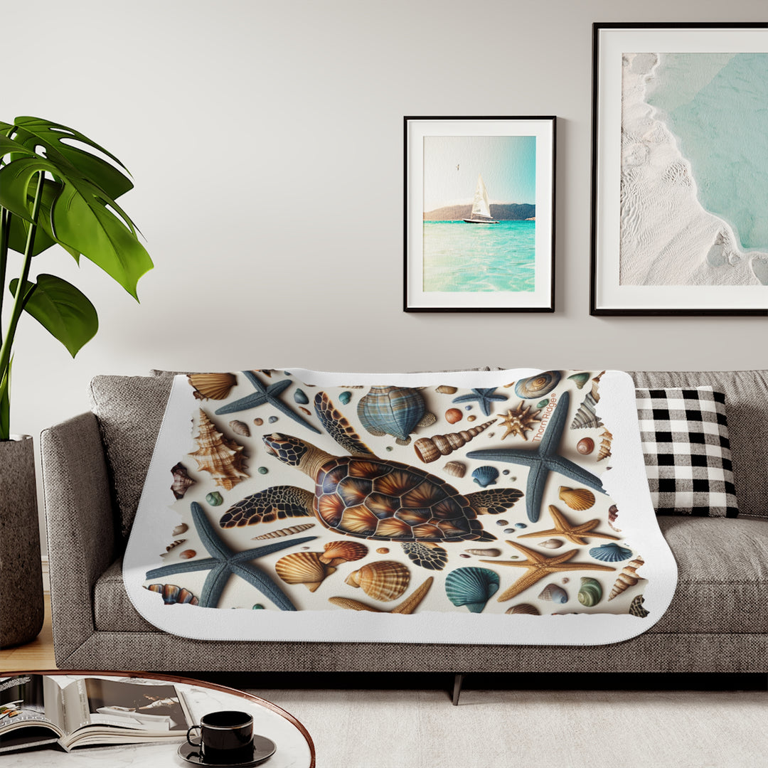 Sea Turtle and sea shells  illustration on a white sherpa blanket branded Thorn Ridge®