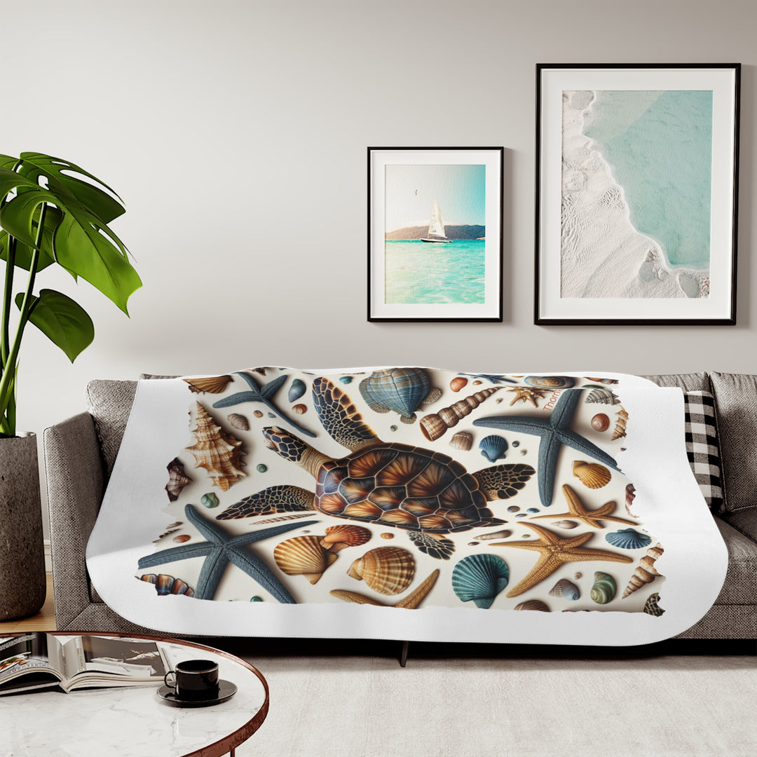 Sea Turtle and sea shells  illustration on a white sherpa blanket branded Thorn Ridge®