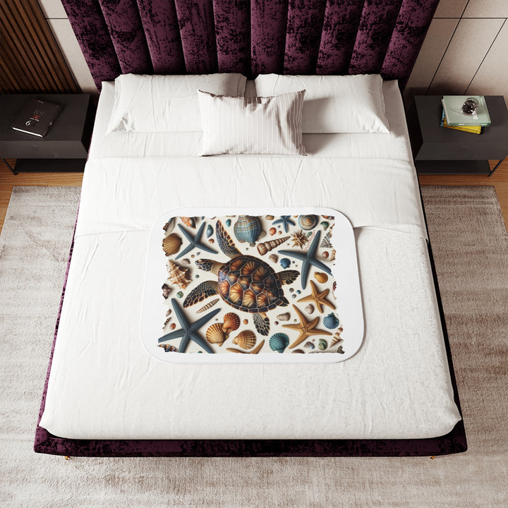 Sea Turtle and sea shells  illustration on a white sherpa blanket branded Thorn Ridge®