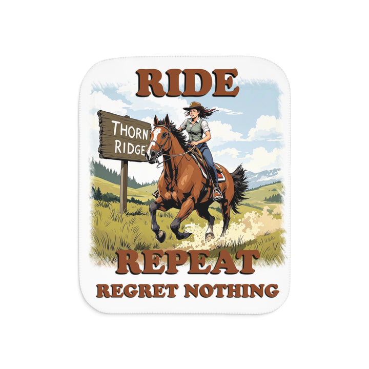 Decorative white sherpa blanket with a horse and rider graphic and text 'Ride Repeat Regret Nothing' and a sign that says the brand name Thorn Ridge®.
