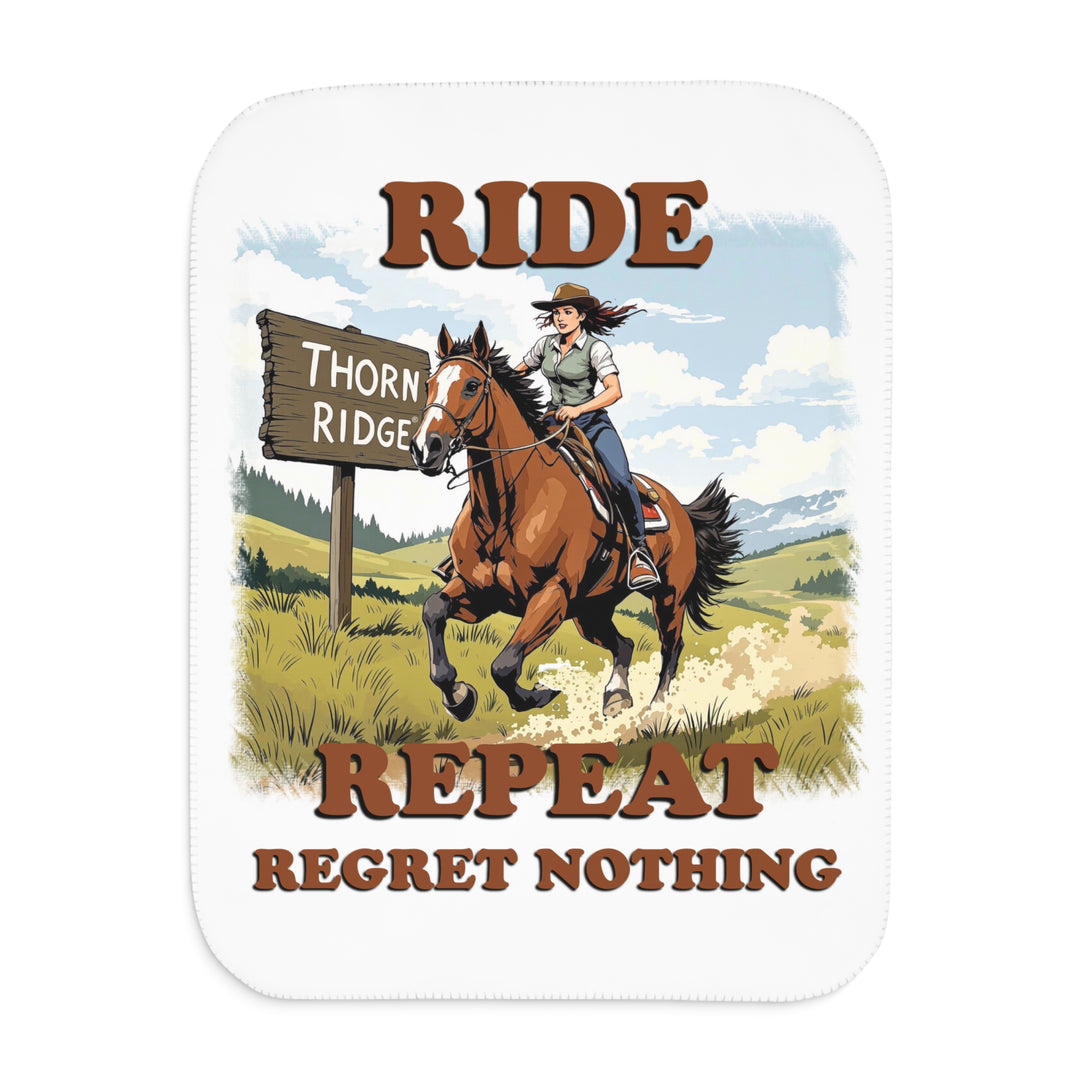 Decorative white sherpa blanket with a horse and rider graphic and text 'Ride Repeat Regret Nothing' and a sign that says the brand name Thorn Ridge®.