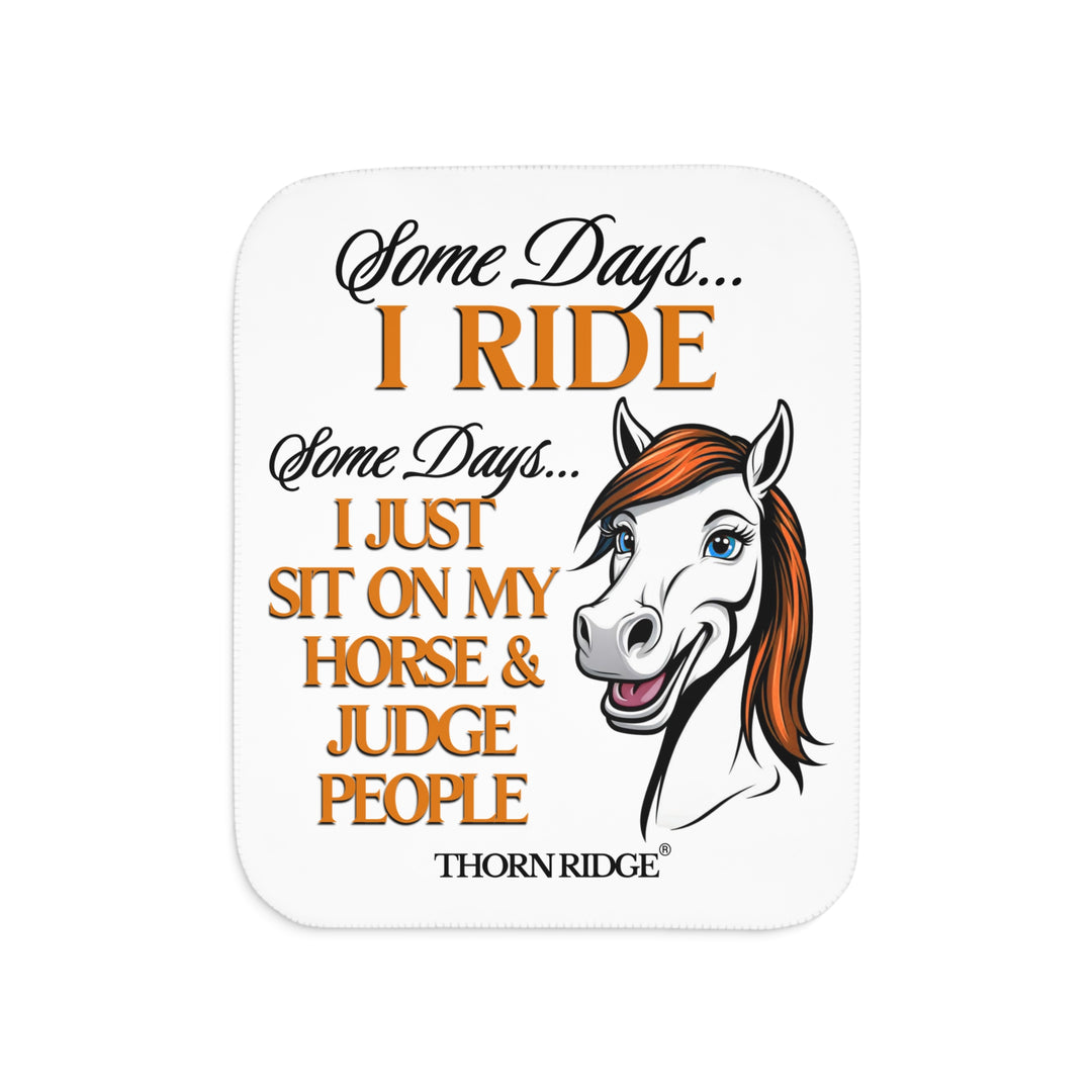 Some Days I ride Some days I just sit on my horse and judge people white sherpa blanket by Thorn Ridge® with  a white horse cartoon with a red mane and blue eyes.