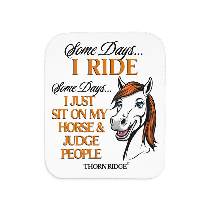 Some Days I ride Some days I just sit on my horse and judge people white sherpa blanket by Thorn Ridge® with  a white horse cartoon with a red mane and blue eyes.