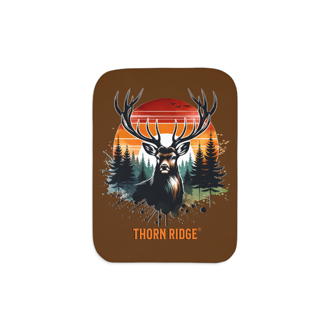 Guardian Buck at Sunset by Thorn Ridge® with an illustration of a buck facing the camera with a sunset in the background and forest trees.