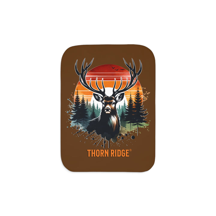 Guardian Buck at Sunset by Thorn Ridge® with an illustration of a buck facing the camera with a sunset in the background and forest trees.