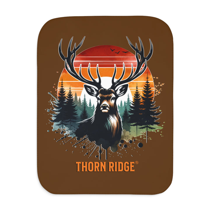 Guardian Buck at Sunset by Thorn Ridge® with an illustration of a buck facing the camera with a sunset in the background and forest trees.