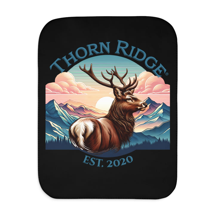 Black sherpa blanket with an illustration of a buck with antlers looking to the right with images of mountains in the background and the text Thorn Ridge® Est. 2020