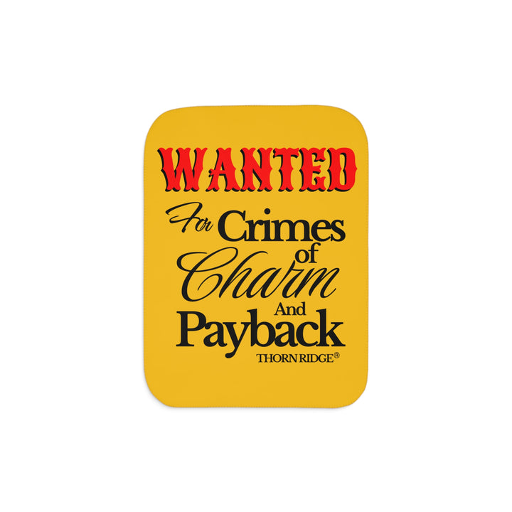 Yellow Sherpa Blanket with Wanted for crimes of charm and payback text branded Thorn Ridge® Wanted is in red text and the rest is in black text.