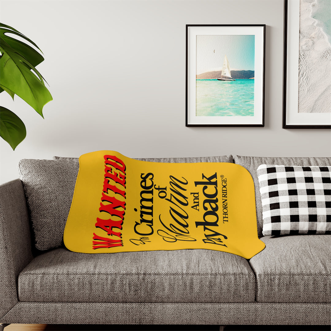 Yellow Sherpa Blanket with Wanted for crimes of charm and payback text branded Thorn Ridge® Wanted is in red text and the rest is in black text.