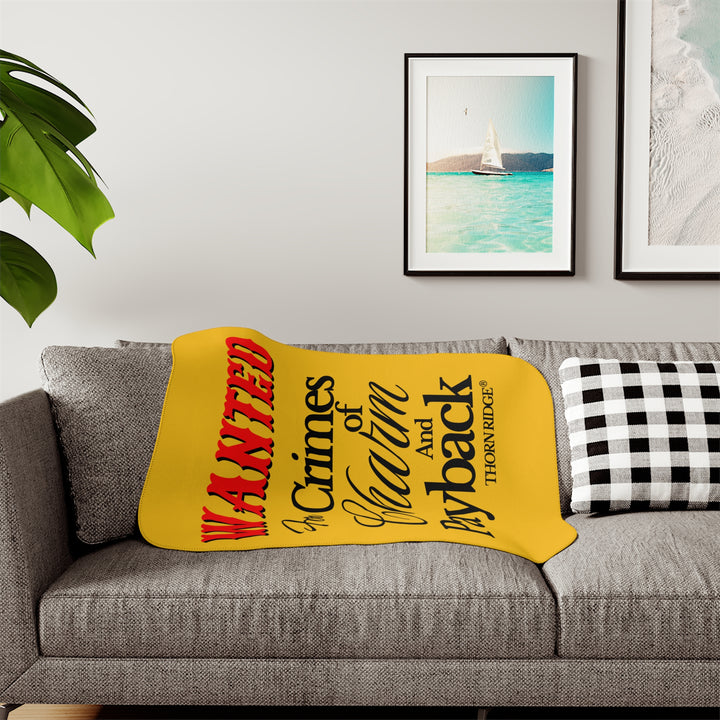 Yellow Sherpa Blanket with Wanted for crimes of charm and payback text branded Thorn Ridge® Wanted is in red text and the rest is in black text.