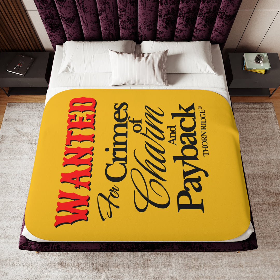 Yellow Sherpa Blanket with Wanted for crimes of charm and payback text branded Thorn Ridge® Wanted is in red text and the rest is in black text.