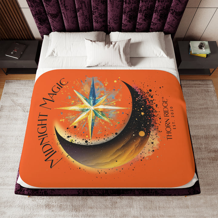 Midnight Magic orange sherpa blanket featuring a star and moon design and branded as Thorn Ridge® EST 2020
