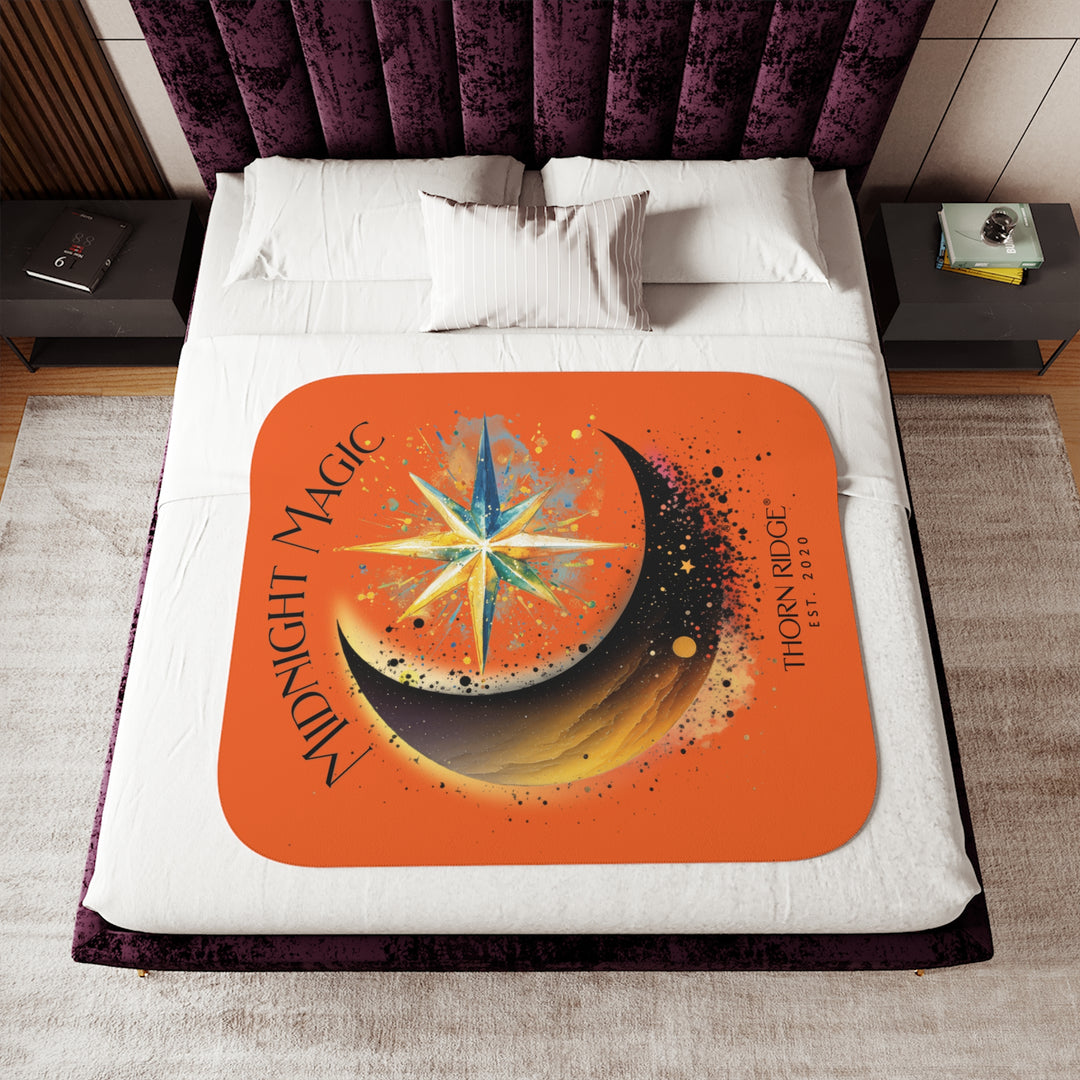 Midnight Magic orange sherpa blanket featuring a star and moon design and branded as Thorn Ridge® EST 2020