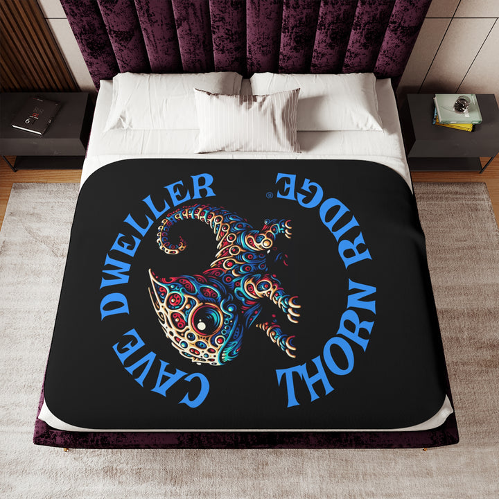 Cave Dweller by Thorn Ridge® black sherpa blanket featuring a weird lizard creature.