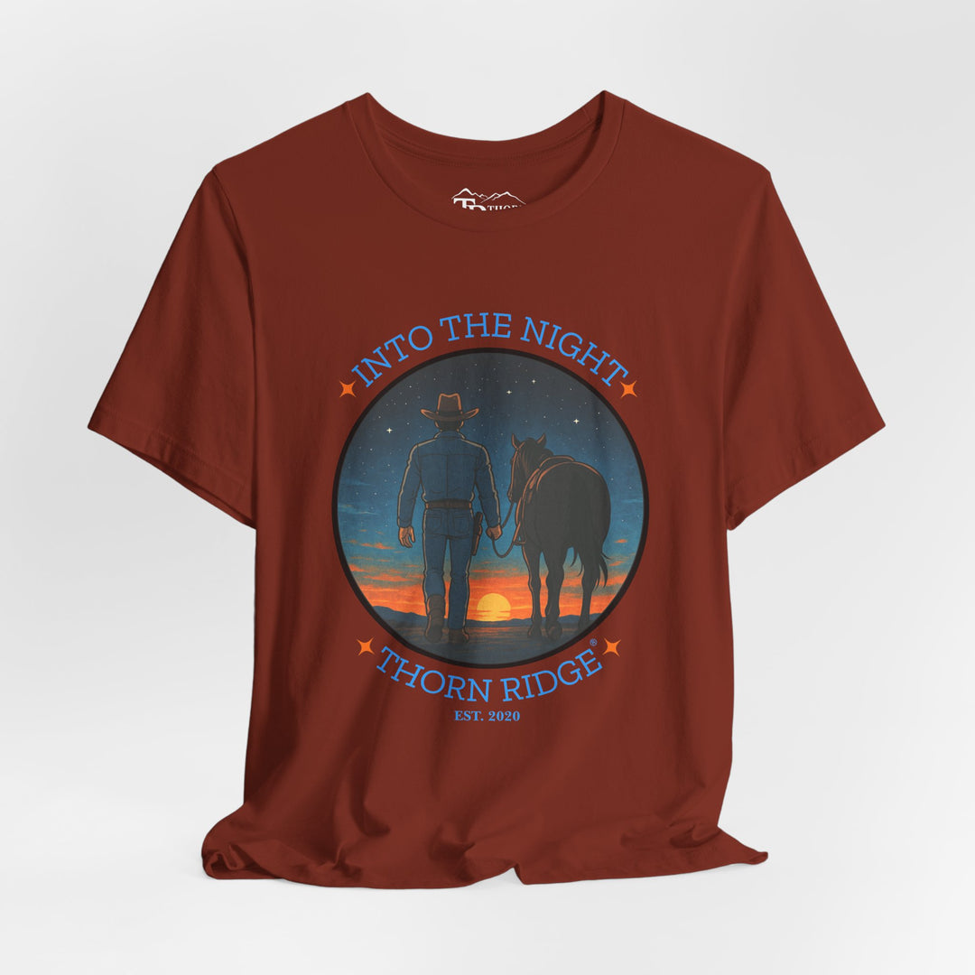 t-shirt with 'Into the Night' and 'Thorn Ridge' graphic design of a cowboy leading his horse into the setting sun as night is falling.
