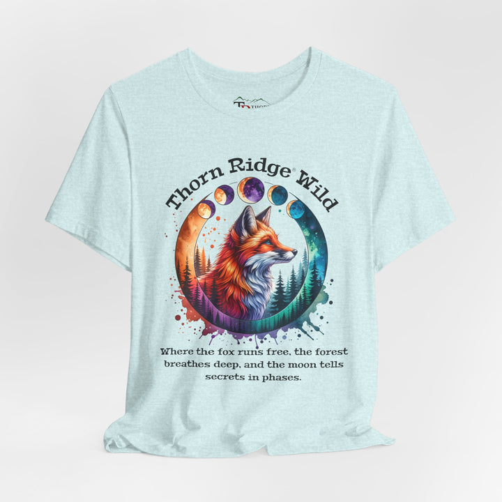 Thorn Ridge Wild Graphic Tee featuring a fox, forest, and moon phases. 