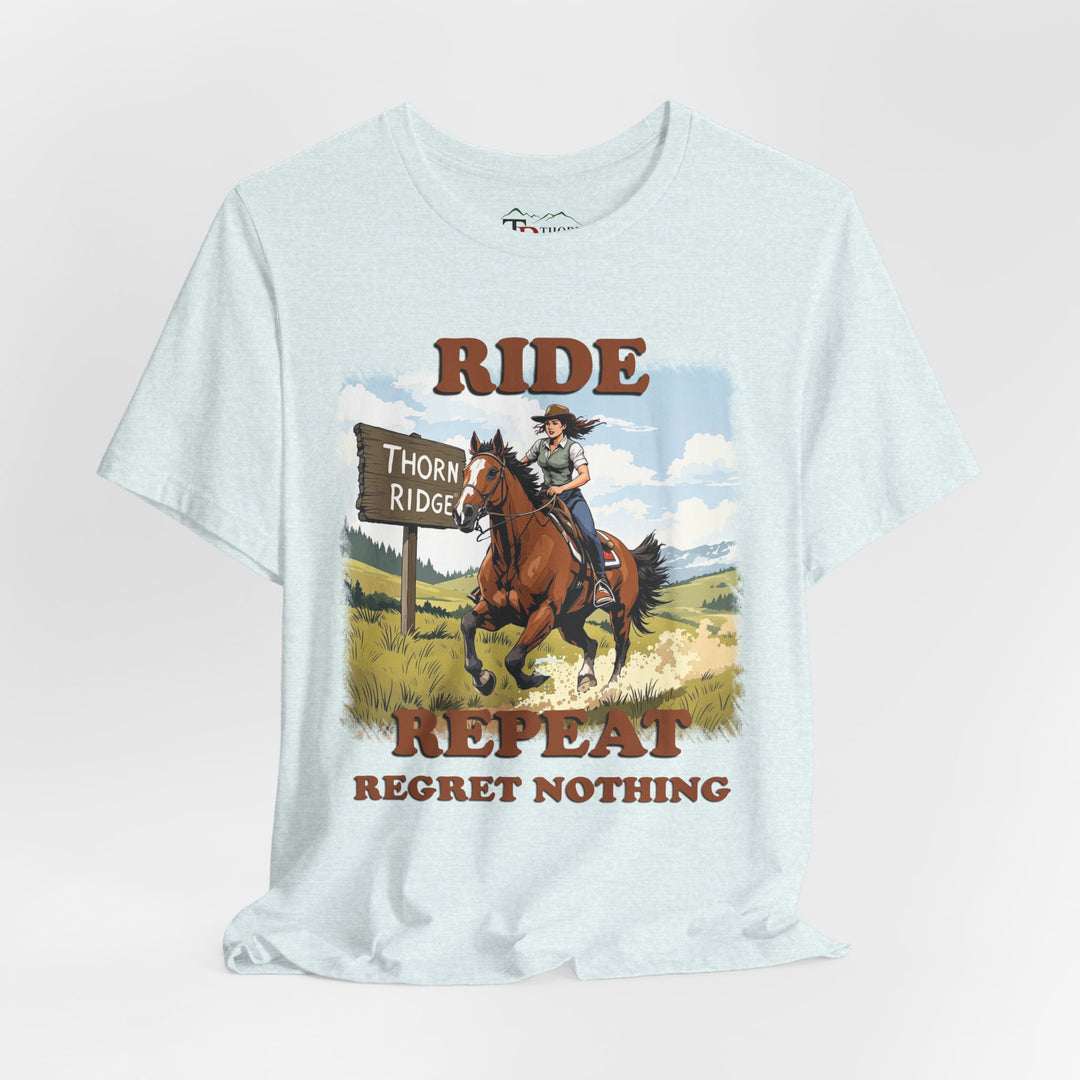 Ride Repeat Regret Nothing tee with a woman riding a galloping horse across the feild with the mountains in the background and a sign labeled Thorn Ridge®