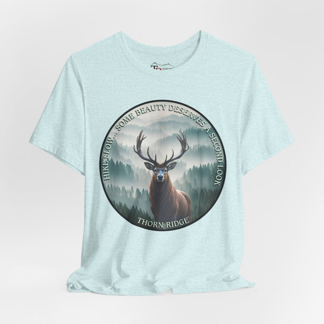 Hike Slow Some Beauty Deserves a Second Look tee with deer and mountains within a circular graphic by Thorn Ridge®