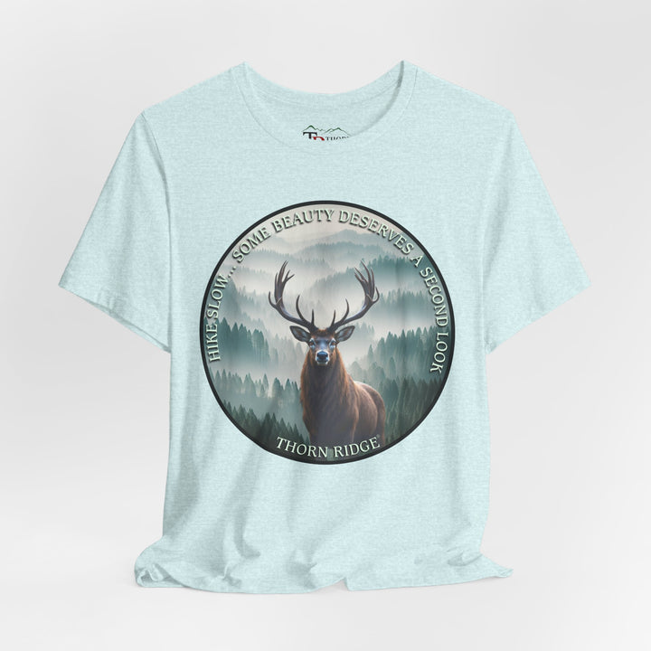 Hike Slow Some Beauty Deserves a Second Look tee with deer and mountains within a circular graphic by Thorn Ridge®