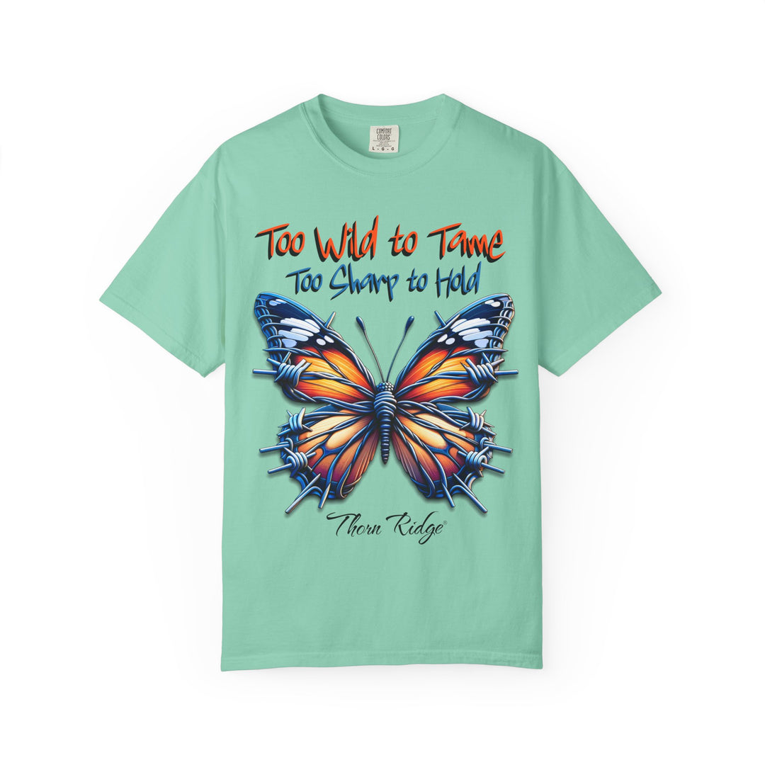 Too Wild To Tame Too Sharp To Hold Graphic Tee with a butterfly with barbed wire wings labeled Thorn Ridge. 