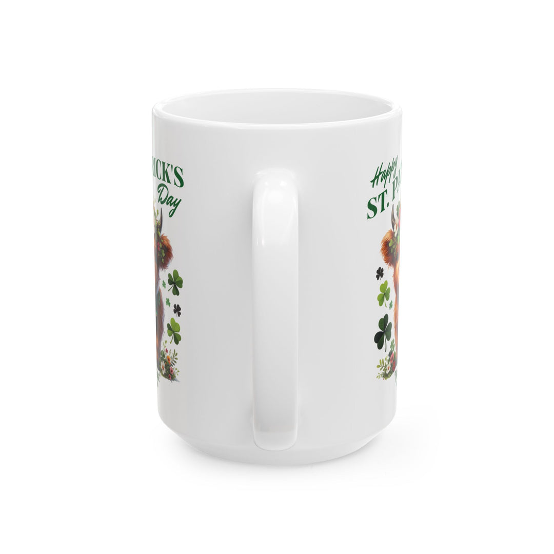 White mug with a design of a highland cow wearing a flower crown, surrounded by shamrocks, and 'Happy St. Patrick's Day' and Thorn Ridge®