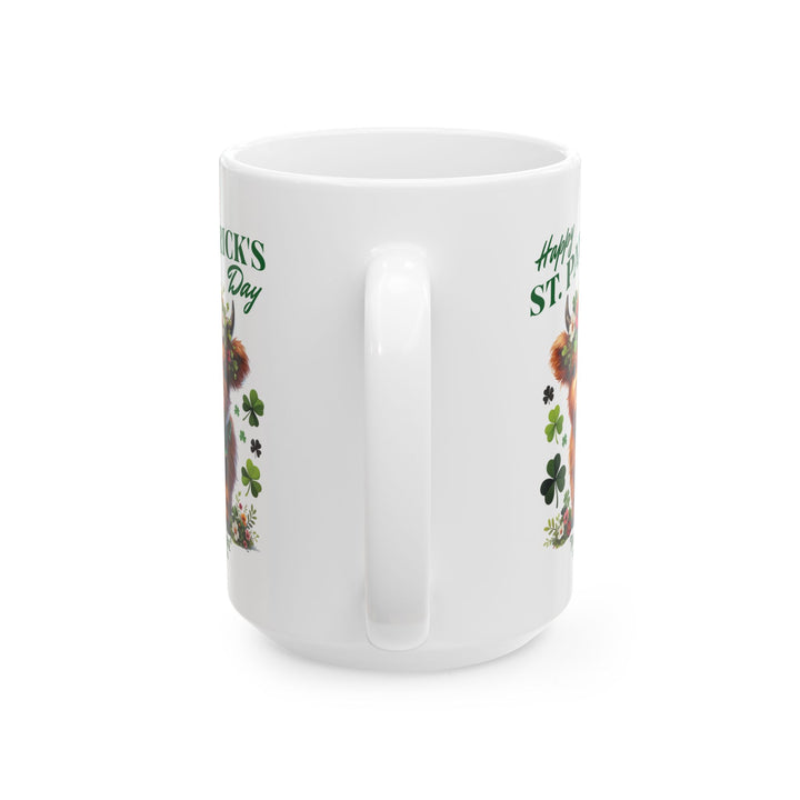 White mug with a design of a highland cow wearing a flower crown, surrounded by shamrocks, and 'Happy St. Patrick's Day' and Thorn Ridge®
