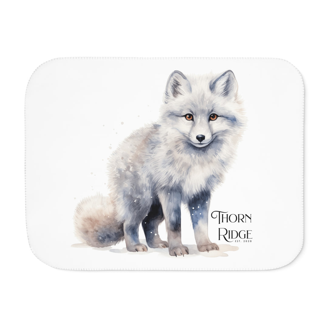 White Arctic fox illustration on a white Sherpa Blanket with 'Thorn Ridge' branding.