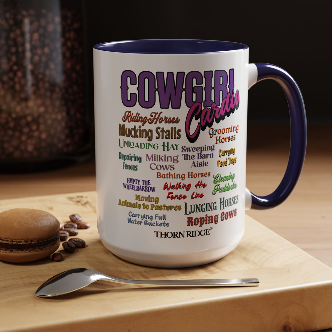 Mug with 'Cowgirl Cardio' text and blue handle on a white background