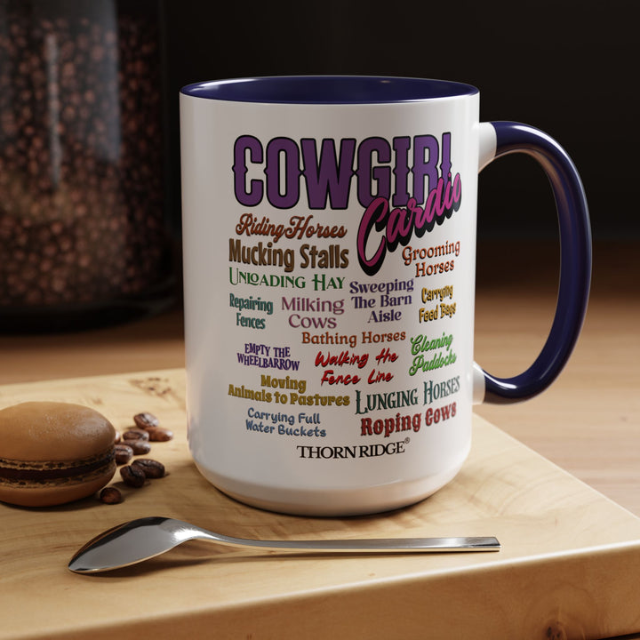 Mug with 'Cowgirl Cardio' text and blue handle on a white background