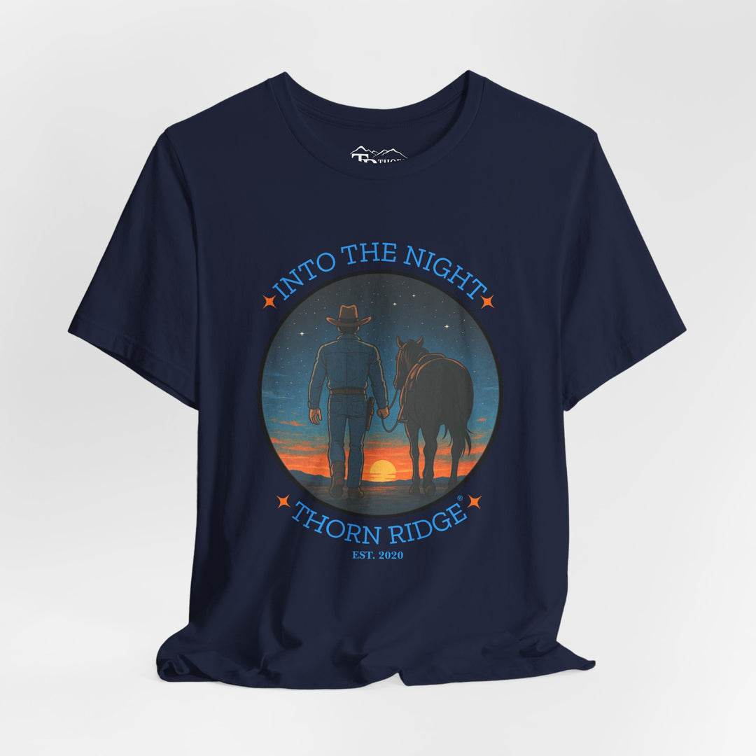t-shirt with 'Into the Night' and 'Thorn Ridge' graphic design of a cowboy leading his horse into the setting sun as night is falling.