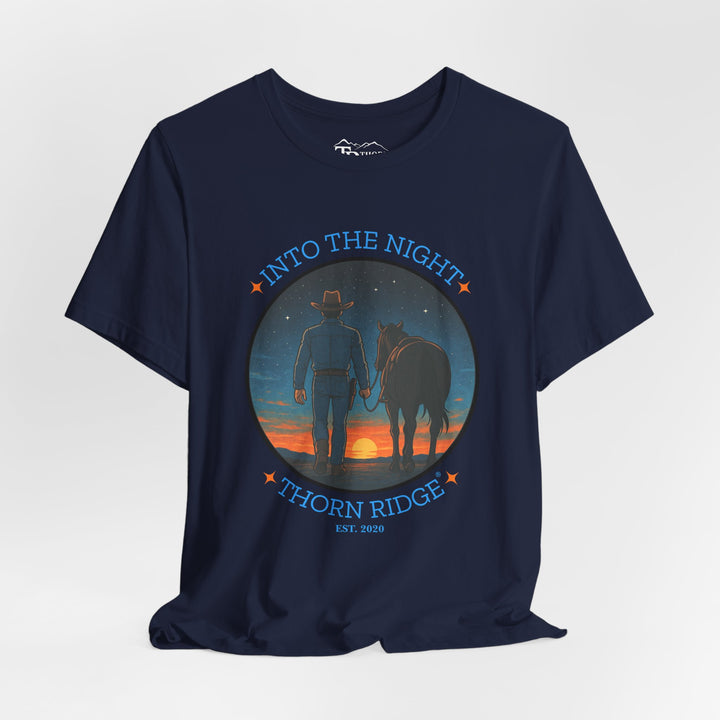 t-shirt with 'Into the Night' and 'Thorn Ridge' graphic design of a cowboy leading his horse into the setting sun as night is falling.
