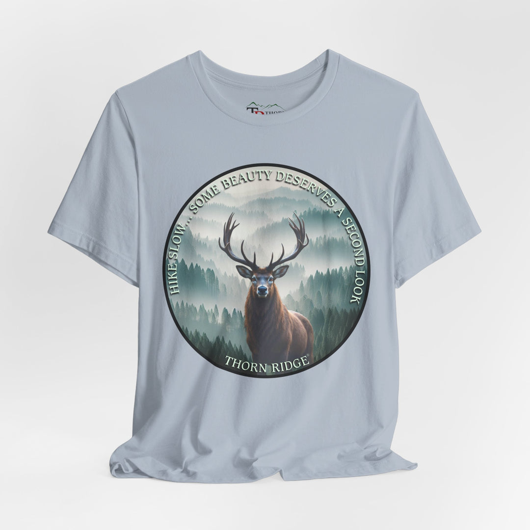 Hike Slow Some Beauty Deserves a Second Look tee with deer and mountains within a circular graphic by Thorn Ridge®