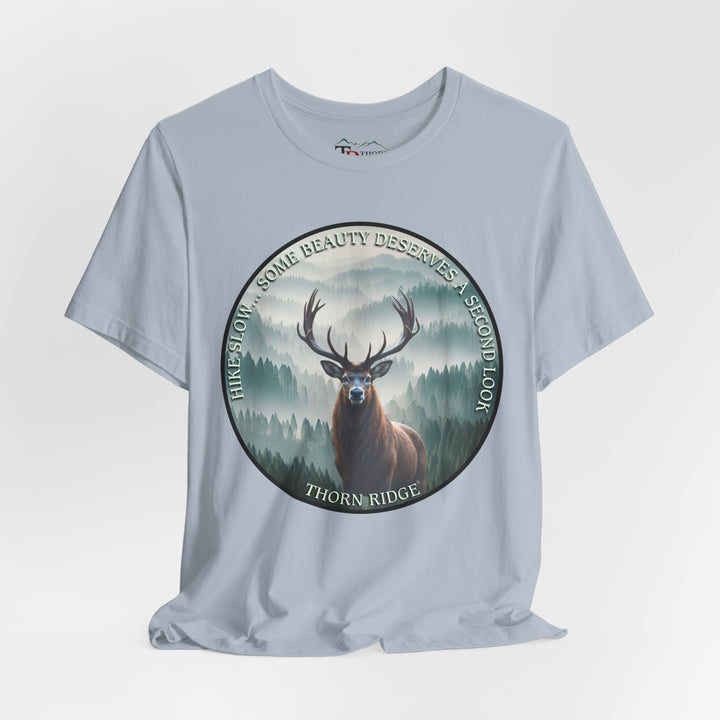 Hike Slow Some Beauty Deserves a Second Look tee with deer and mountains within a circular graphic by Thorn Ridge®