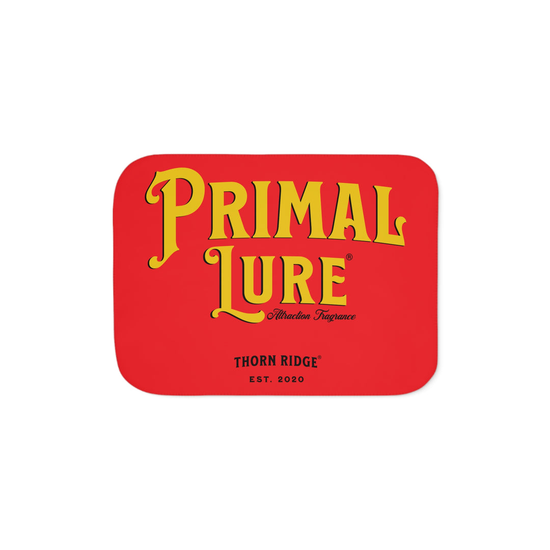 Prinmal Lure Attraction Fragrance by Thorn Ridge® in gold on a red sherpa blanket